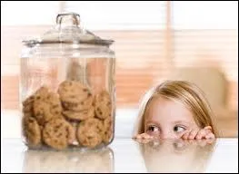 When little Annie stole the first biscuit, she got (... ) with it.