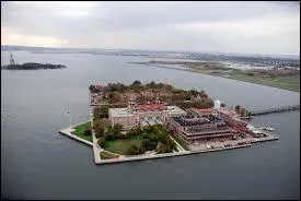 Which island is south of Ellis Island?